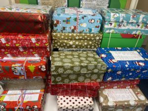 Shoeboxes decorated in Christmas wrapping paper